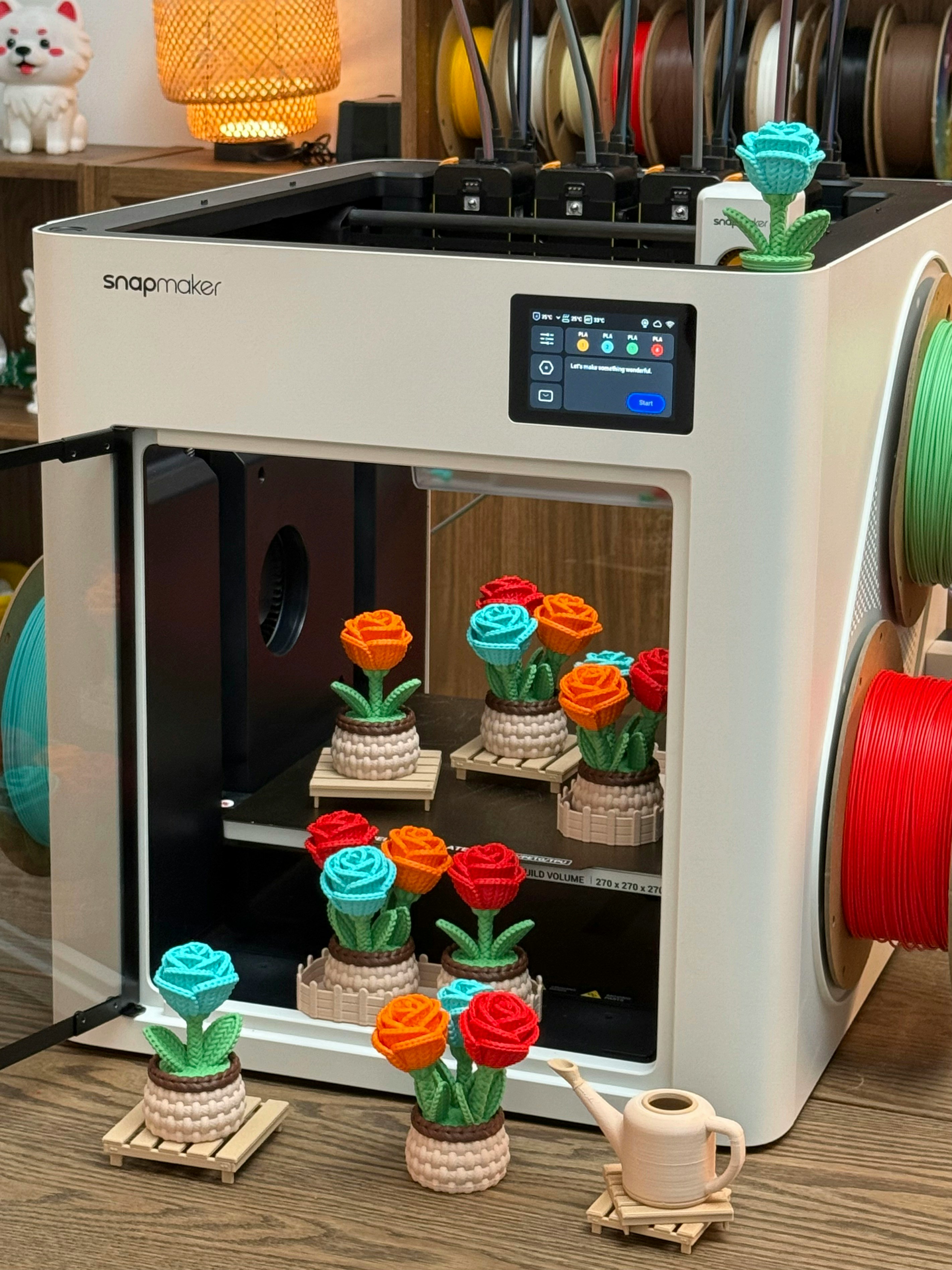 Colourful 3D-printed objects arranged on a workbench